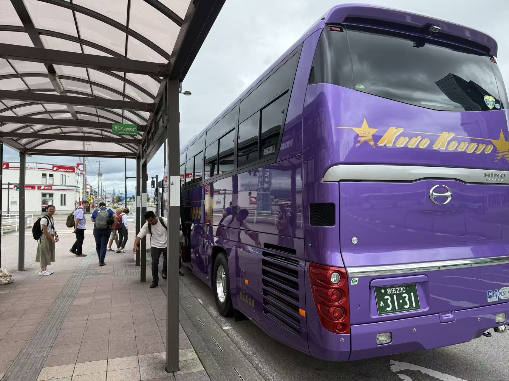 Pilgrims boarding a private coach in Japan